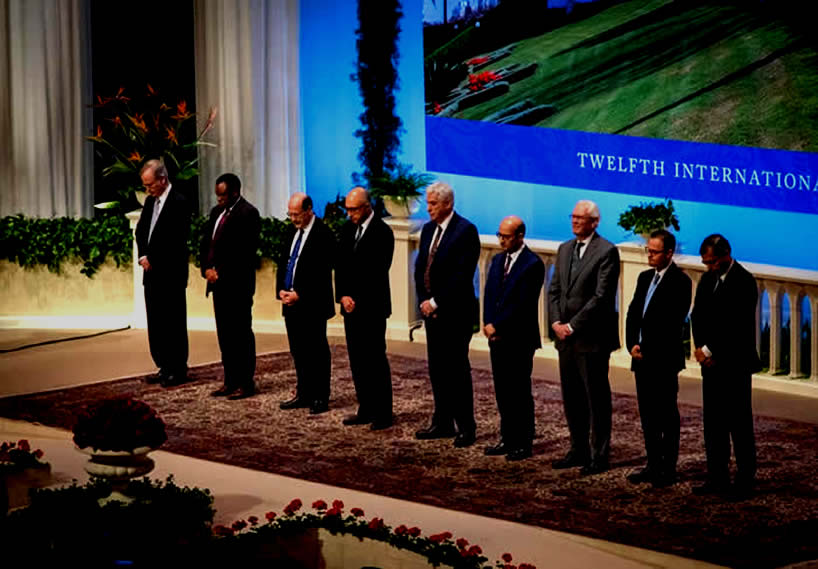 The members of the Universal House of Justice are, from left to right, Paul Lample, Chuungu Malitonga, Payman Mohajer, Shahriar Razavi, Stephen Hall, Ayman Rouhani, Stephen Birkland, Juan Mora, and Praveen Mallik. The House of Justice was elected by delegates to the 12th International Baha’i Convention in Haifa.